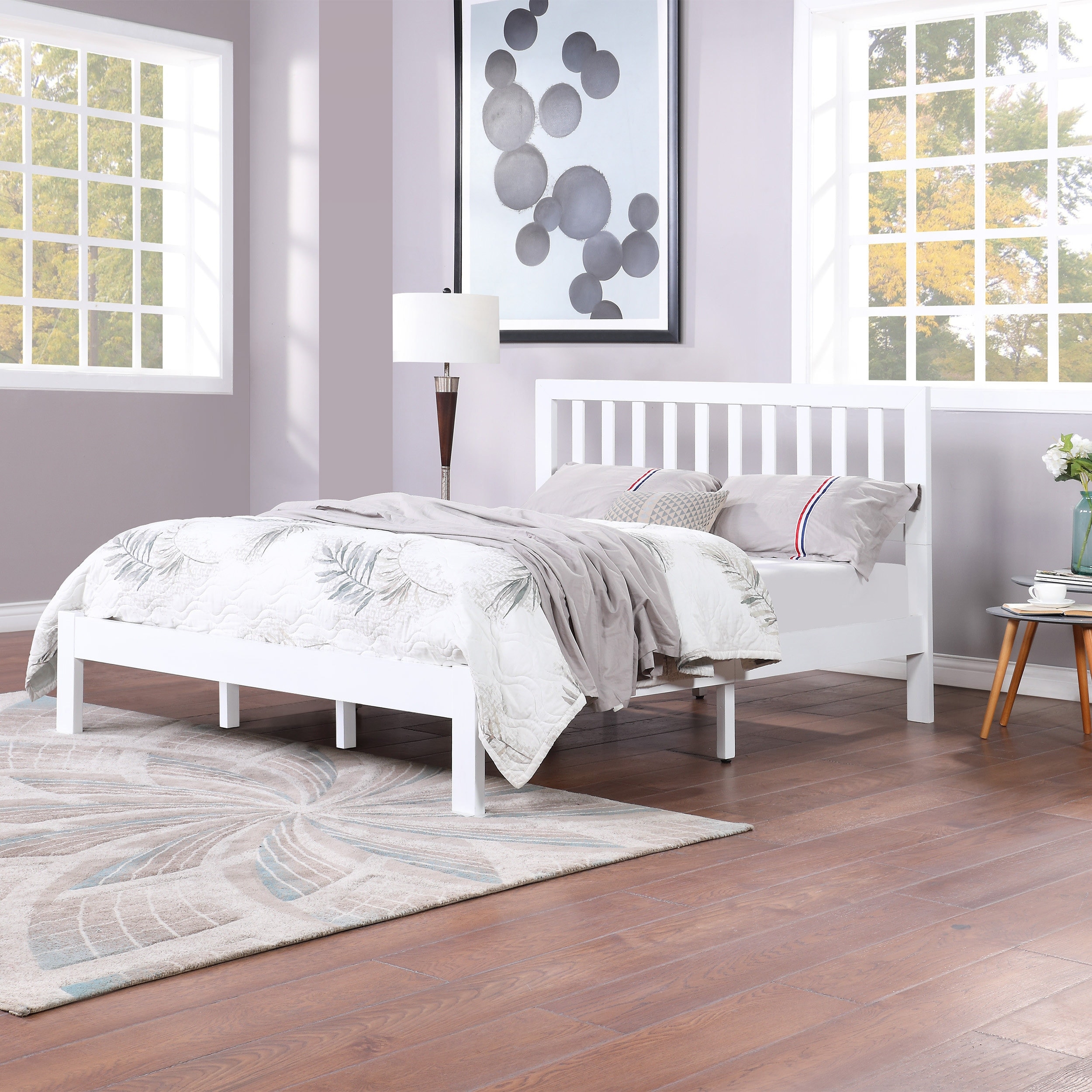 This bed frame comes with multiple wooden slats and a center bar for substantial support