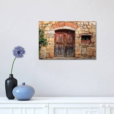 iCanvas "Italy, Monteriggioni. Stone wall, wooden door with planted geraniums." by Emily Wilson Canvas Print