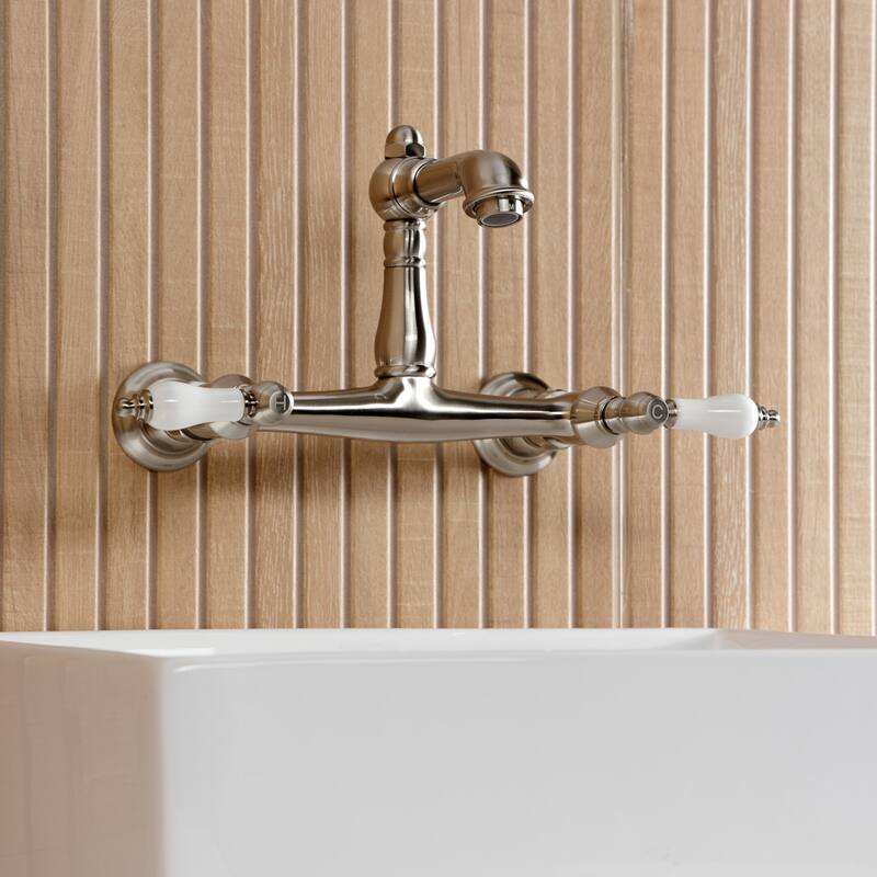Kingston Brass English Country Two-Handle 2-Hole Wall Mount Bathroom Faucet