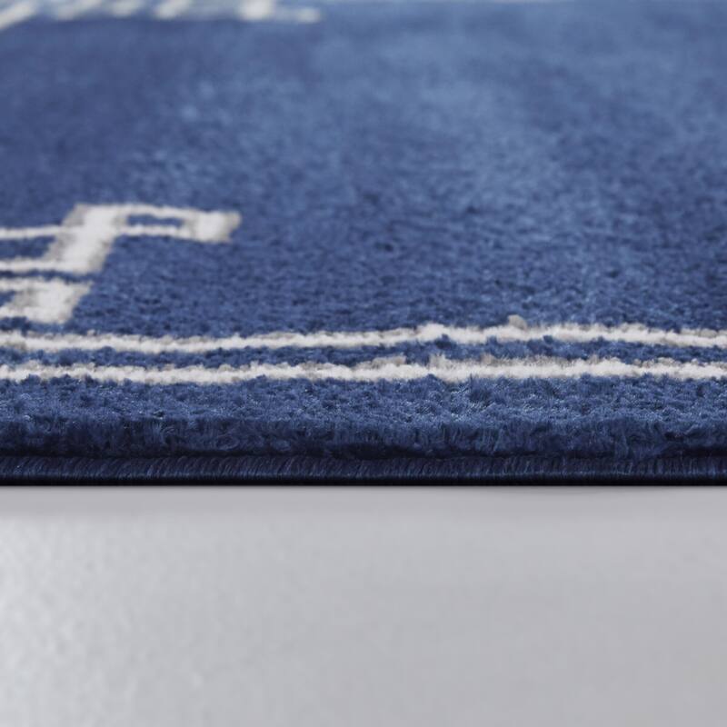Lemaire Geometric Border Area Rug