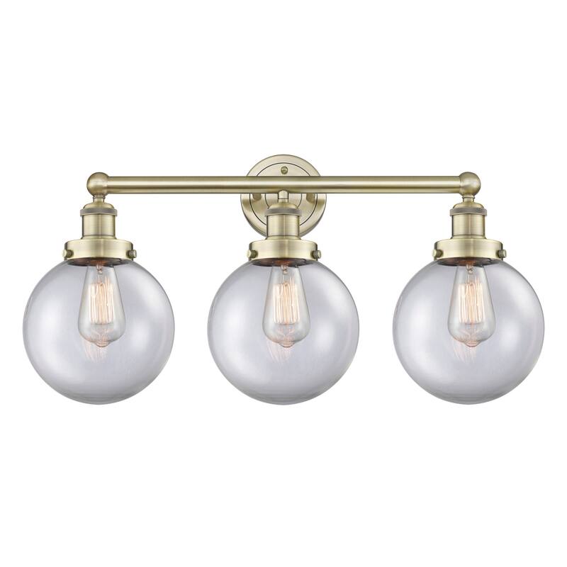 Innovations Lighting 616-3W-10-25 Beacon Vanity Beacon 3 Light 25" - Antique Brass / Clear