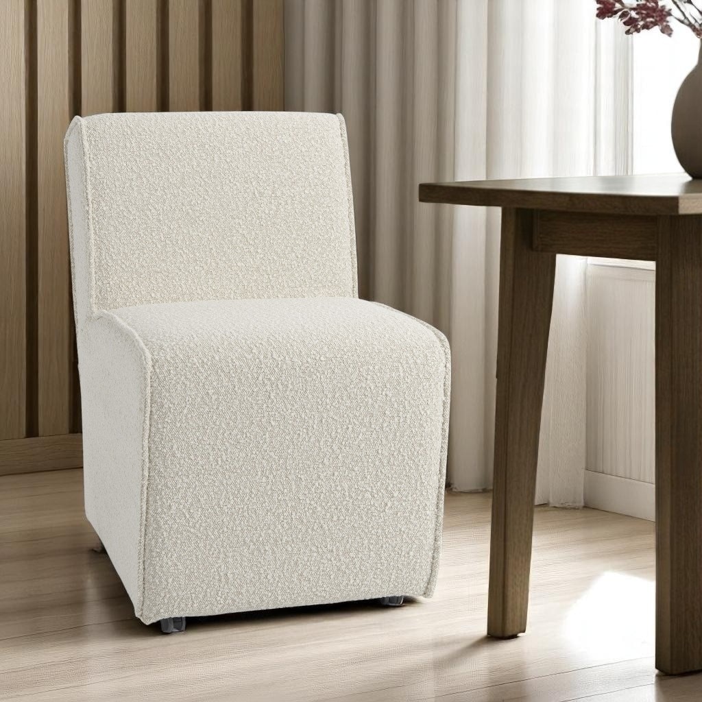 HomeRoots Cream Fully Upholstered Boucle Dining Side Chair With Wheels - 27.17 in. x 31.3 in. x 20.47 in.