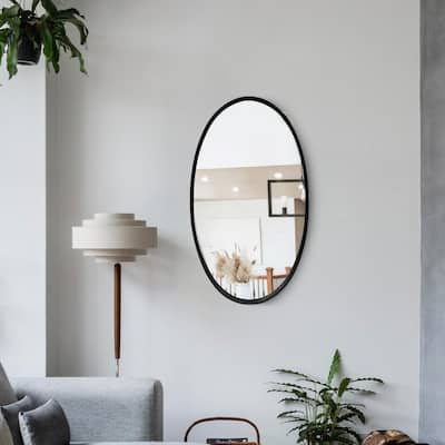 Oval Metal Wall Mirror with Framed Edges and Wooden Backing