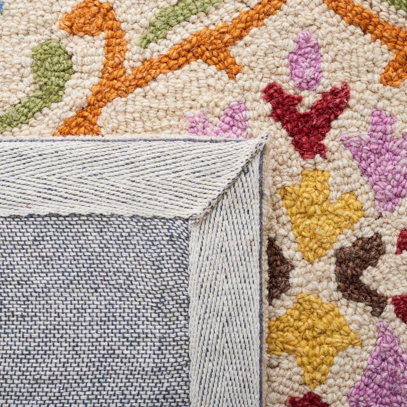 SAFAVIEH Handmade Micro-Loop Sinela Wool Rug