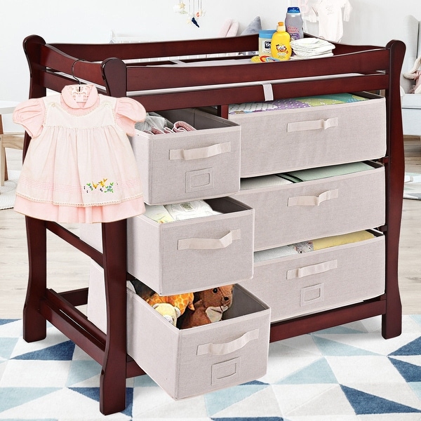 sleigh style baby changing table with 6 storage baskets and pad