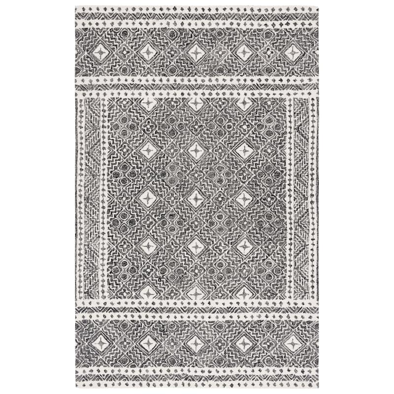 SAFAVIEH Handmade Micro-Loop Jelske Wool Rug