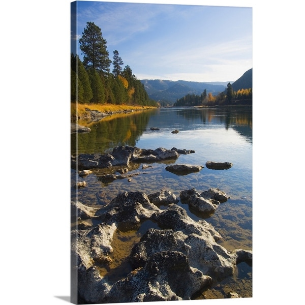 "Clouds and distant mountains reflected in rocky Kootenai River, Montana" Canvas Wall Art