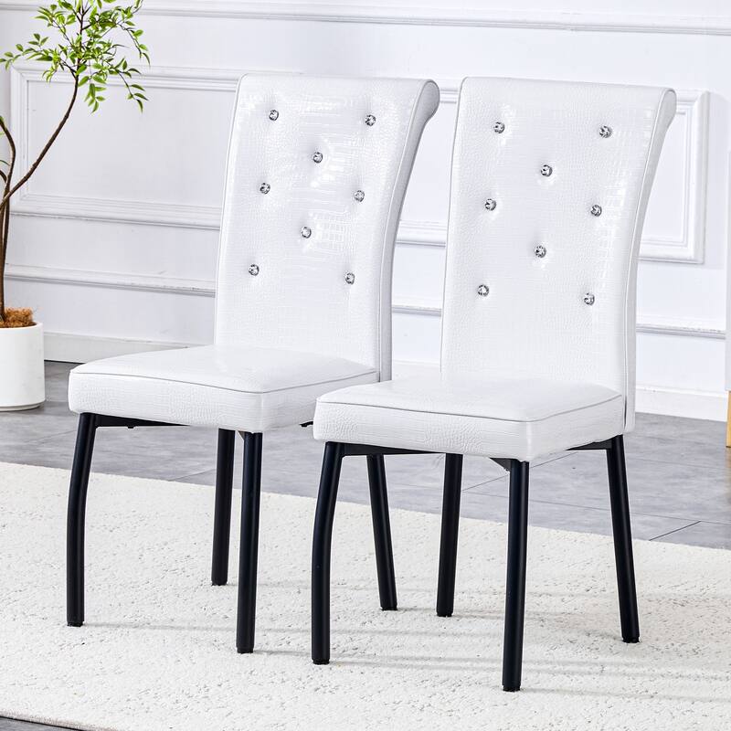 A set of 2 vintage crocodile leather cushioned dining chairs, featuring crystal clasp design and artificial leather design
