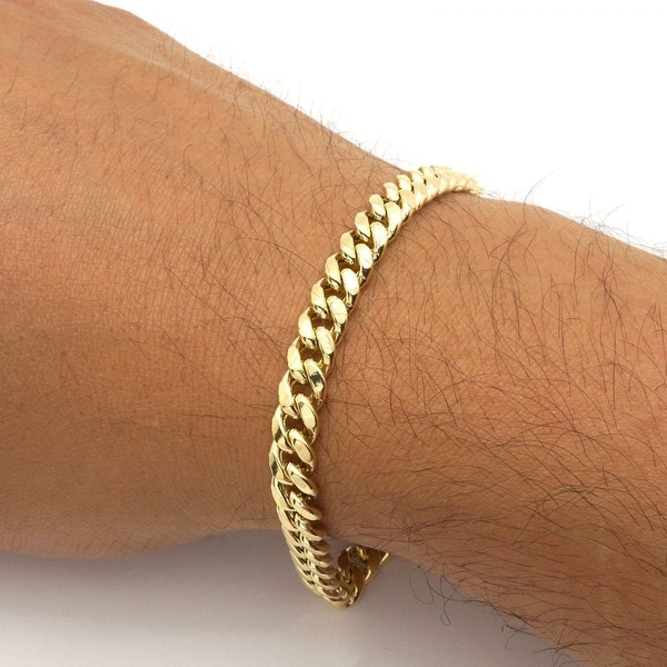 gold cuban link wrist
