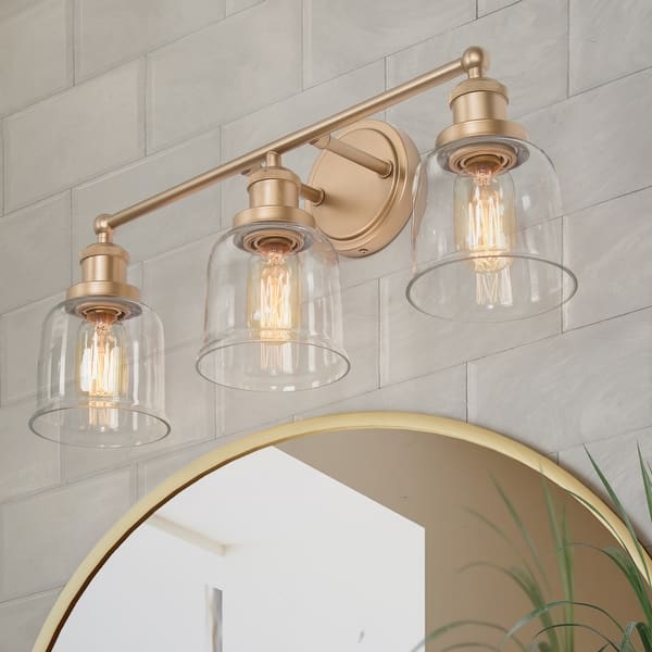 slide 2 of 12, Cionar Mid-century Modern Gold 3-Light Bathroom Vanity Lights with Clear Bell Glass for Powder Room - L21.5"x W7.5"x H 10" L21.5"x W7.5"x H 10"
