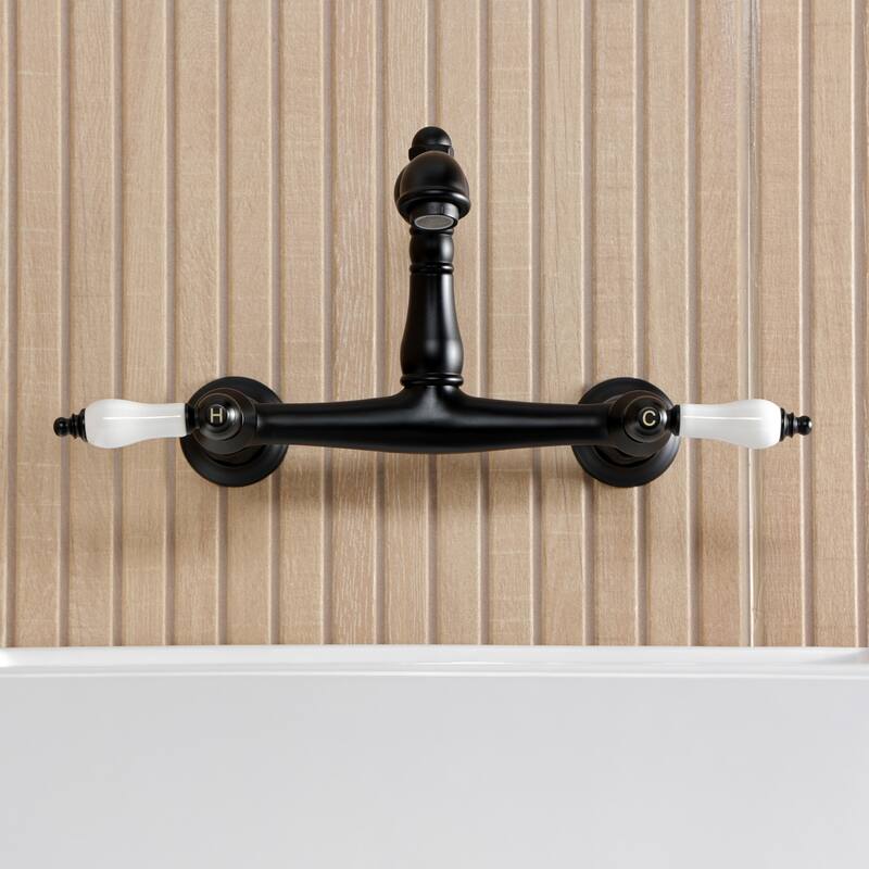 Kingston Brass English Country Two-Handle 2-Hole Wall Mount Bathroom Faucet
