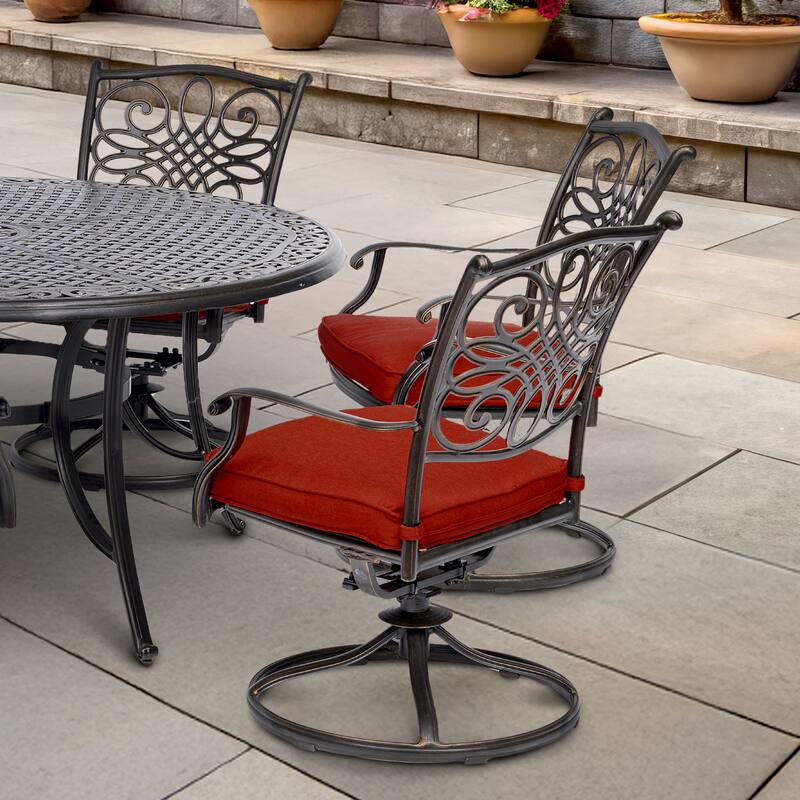 Hanover Traditions 7-Piece Dining Set in Red with a 60 In. Round Cast-top Table and Six Swivel Rockers