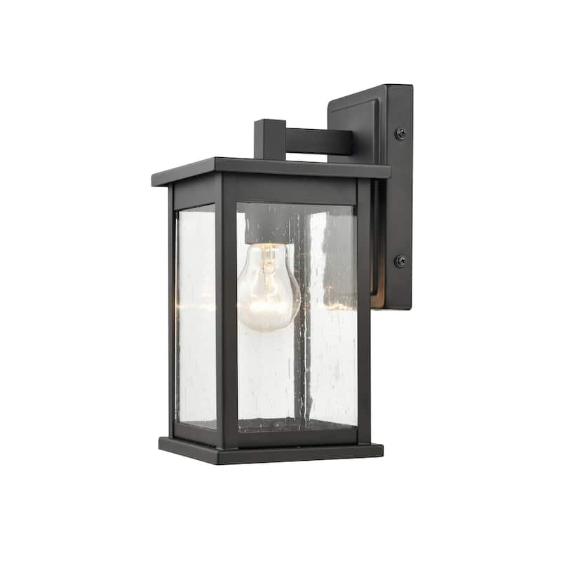 Millennium Lighting Bowton 1 Light Outdoor Wall Sconce in Powder Coat Black with Clear Glass Shade