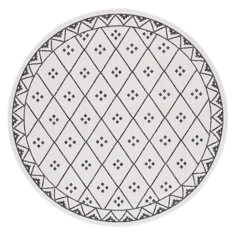 SAFAVIEH Courtyard Mauriceta Indoor/ Outdoor Waterproof Patio Backyard Rug - 6'7" Round - Ivory/Black