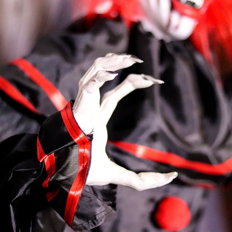 Haunted Hill Farm 5-ft. Animatronic Clown, Indoor/Covered Outdoor Halloween Decoration, Red LED Eyes, Poseable, Hell Raiser