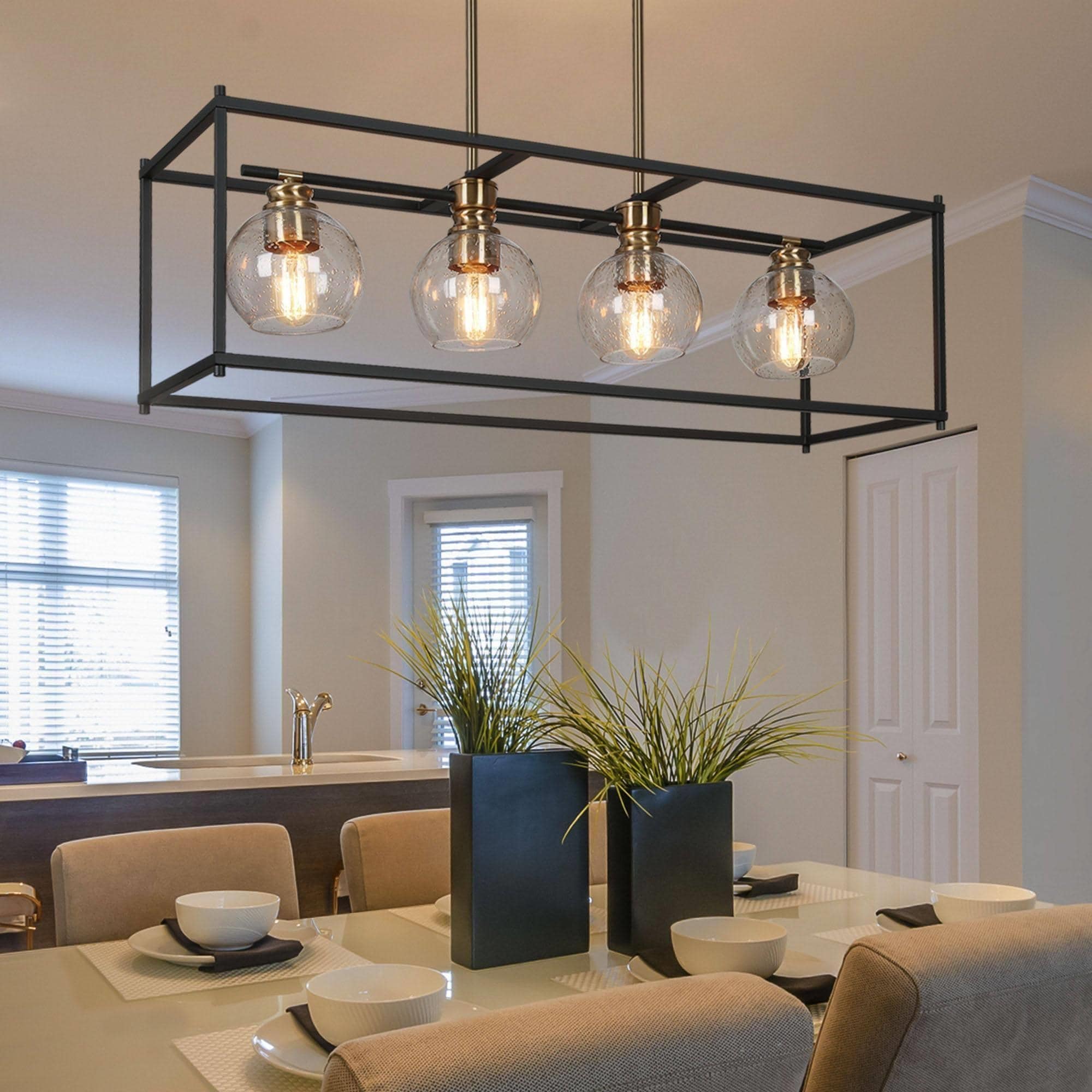 https://ak1.ostkcdn.com/images/products/is/images/direct/582c81b3af8c9444ff5481d6cc5d193f609ba74d/Iain-Modern-4-Light-Black-Gold-Chandelier-Rectangle-Island-Lights-for-Dining-Room.jpg