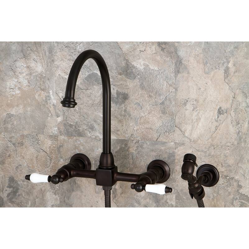 Kingston Brass Restoration Wall Mount Bridge Kitchen Faucet with Brass Sprayer