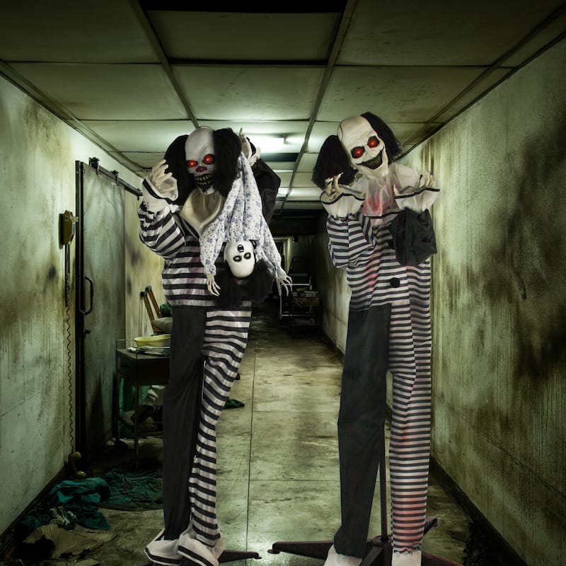 Life-Size Animatronic Talking Clown with Doll with Lights and Sound, Indoor or Covered Outdoor Halloween Decoration