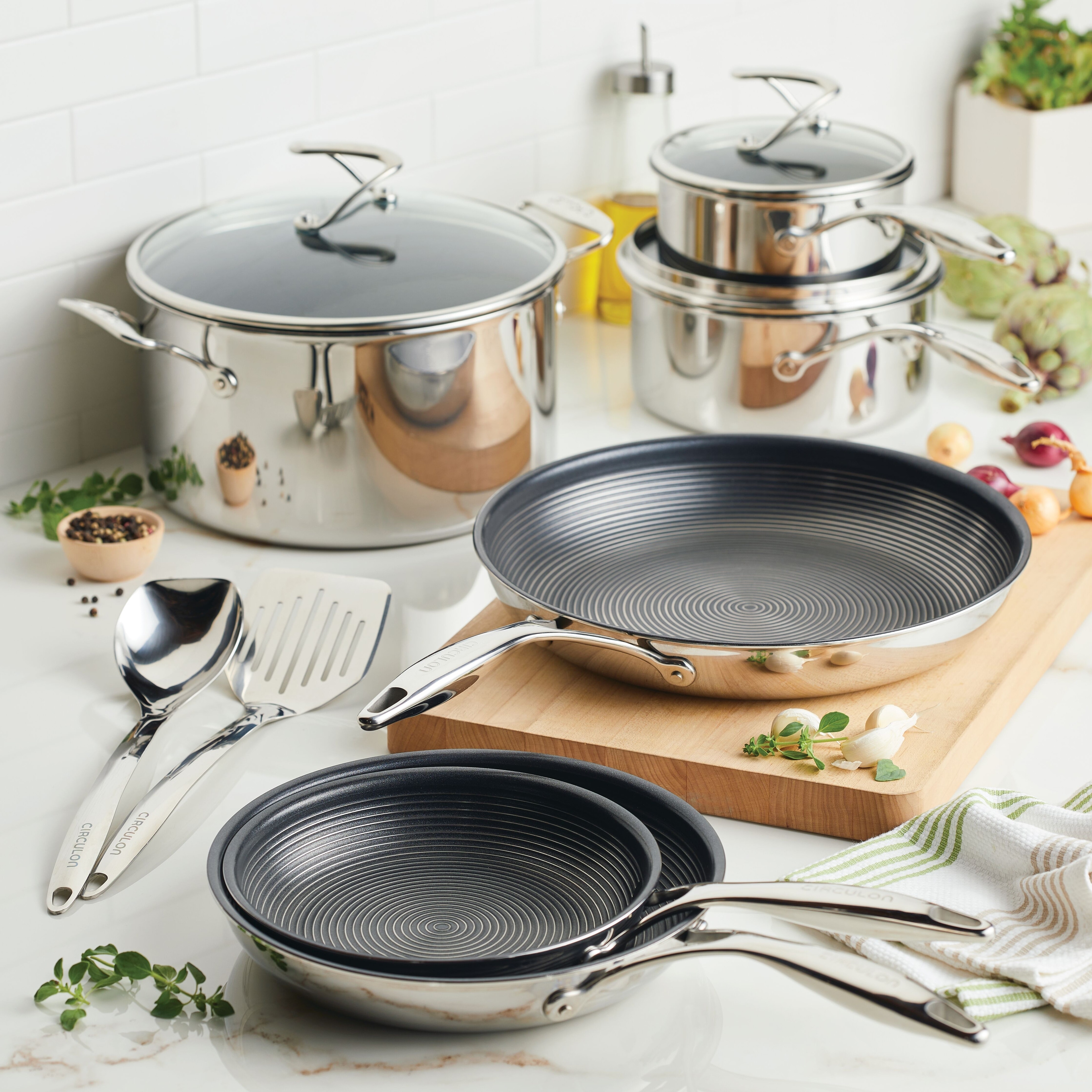 https://ak1.ostkcdn.com/images/products/is/images/direct/5935fe927235c8cd9f6be955c5ba30694e368d75/Circulon-Clad-Stainless-Steel-Induction-Cookware-and-Utensil-Set-with-Hybrid-SteelShield-Nonstick-Technology%2C-11-Piece%2C-Silver.jpg