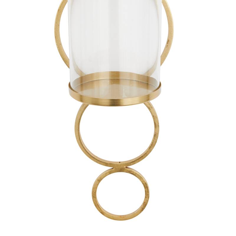 CosmoLiving by Cosmopolitan Metal Stacked Circle Geometric Wall Sconce with Glass Holder - Gold, Black, Silver