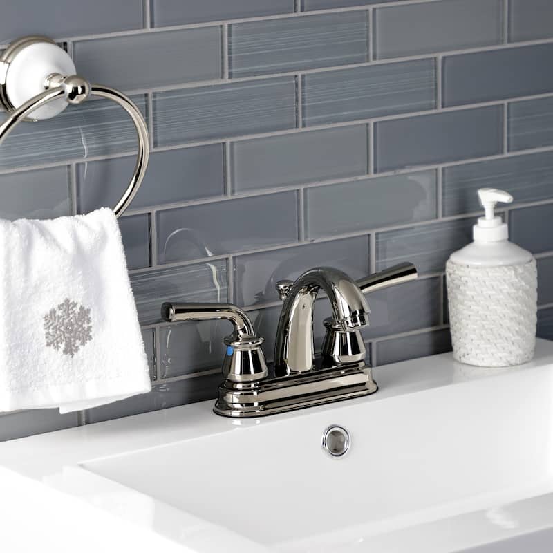 Kingston Brass Restoration Two-Handle 3-Hole Deck Mount 4" Centerset Bathroom Faucet with Plastic Pop-Up