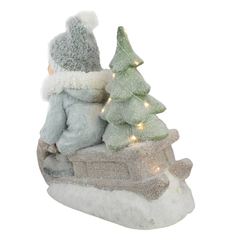 15" Beige and Green Lighted Boy on a Sled Christmas Decoration