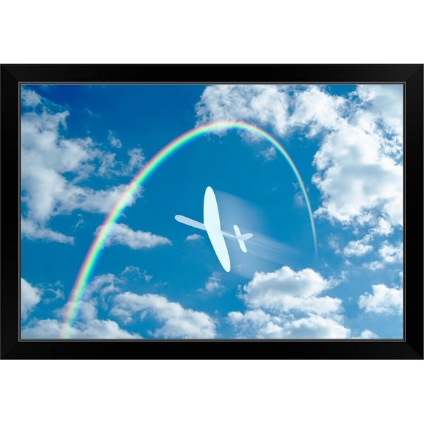 "Paper airplane flying through a blue sky and clouds towards a rainbow" Black Framed Print