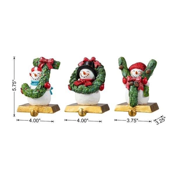 dimension image slide 1 of 3, Glitzhome Resin Santa Snowman Penguin Gnomes with JOY Christmas Stocking Holders Mantel Ornament(Set of 3)