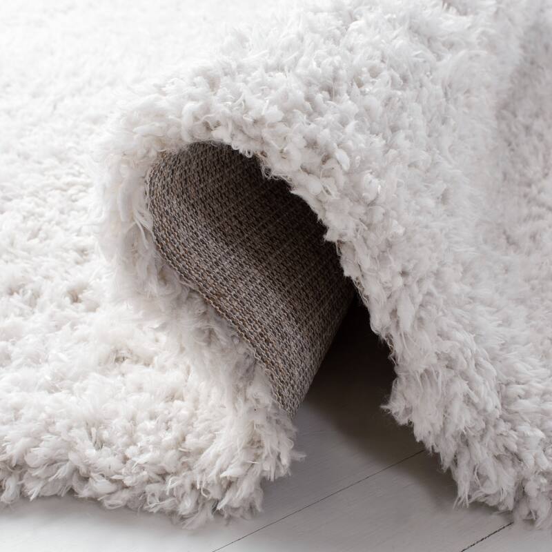 SAFAVIEH Flokati Vojsava Shag Solid Rug