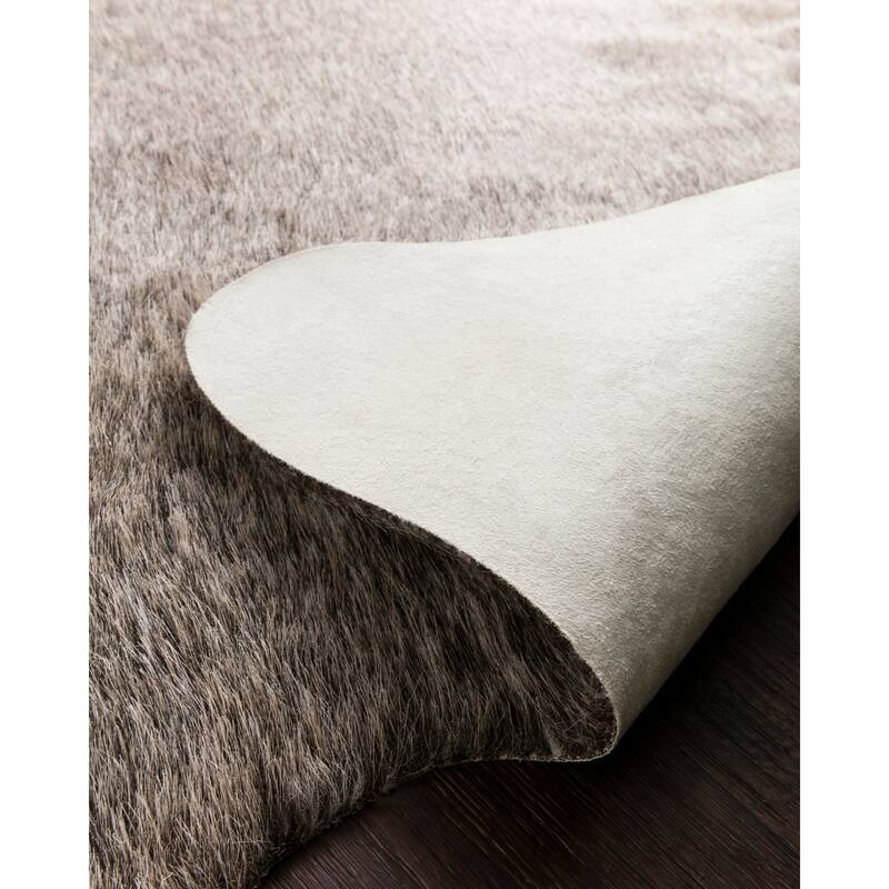 Alexander Home Faux Cowhide Area Rug