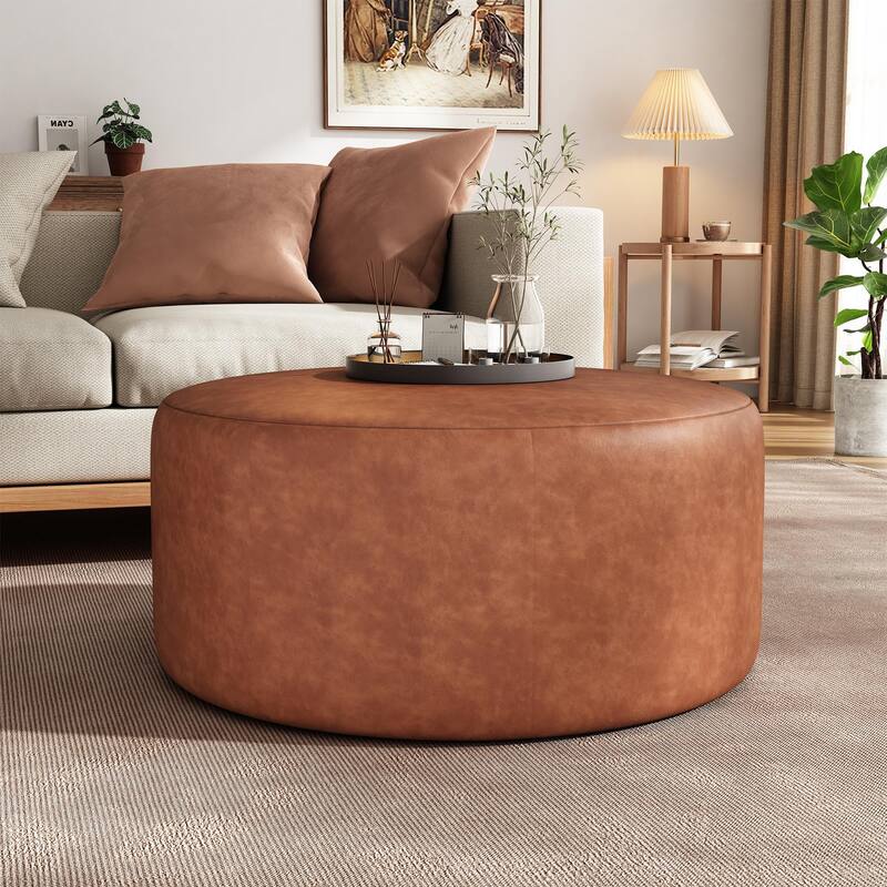 Upholstered round footstool