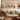 Decorative Assorted Metal Cone Bells on Bar Wall Art - 48", Gold & Tan