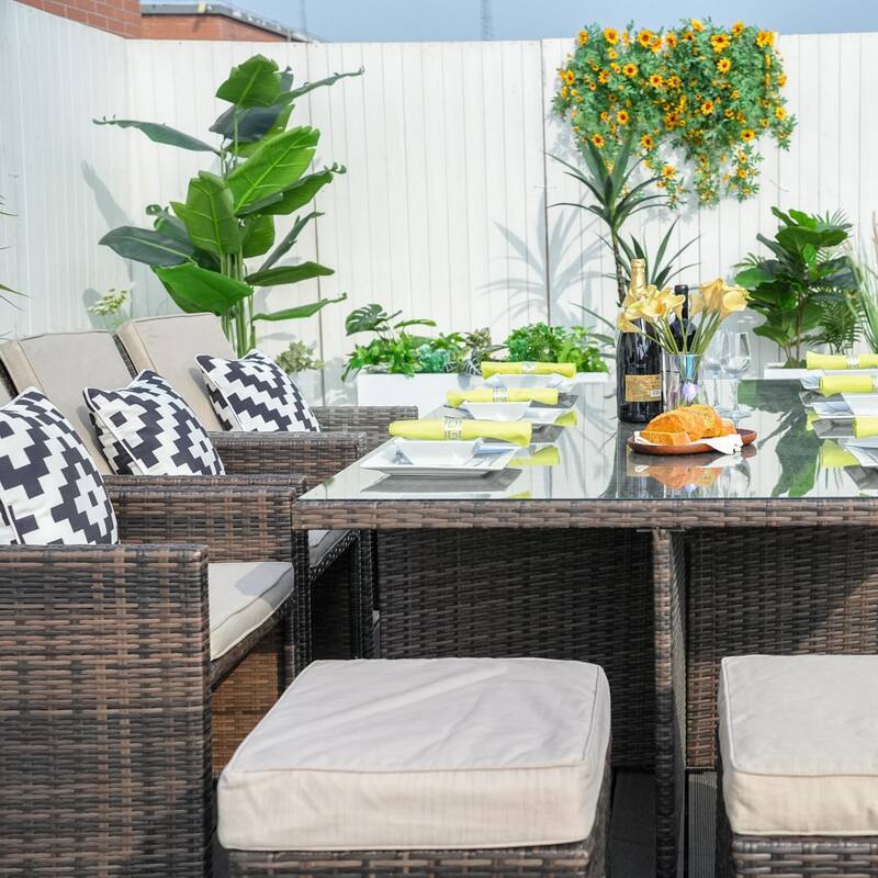 11-Piece Aluminum Wicker Outdoor Dining Set with Cushions and Tempered Glass Tabletop
