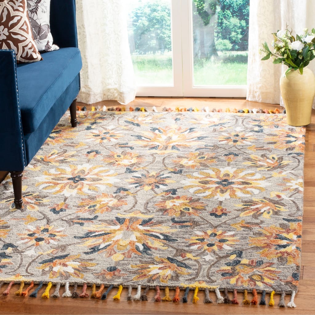 SAFAVIEH Handmade Aspen Orane Floral Braided Tassel Wool Rug