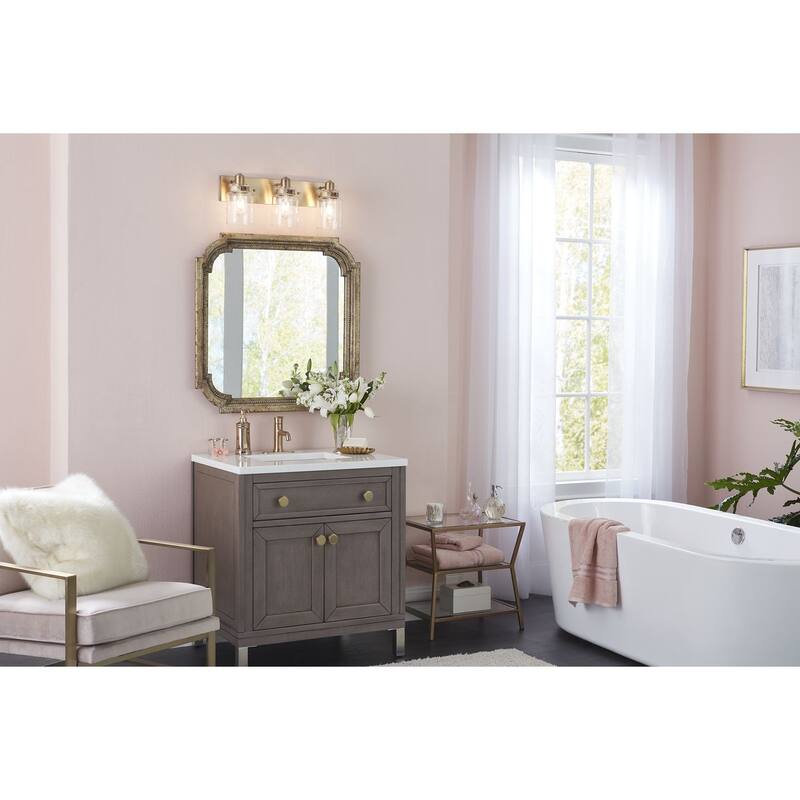 Calhoun Collection Three-Light Vintage Brass Clear Glass Farmhouse Bath Vanity Light - 21.625 in x 6.875 in x 8.625 in