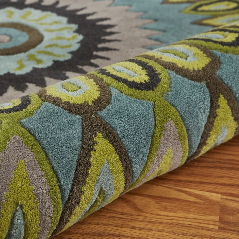 Sevita Bursting Peacock Wool Area Rug