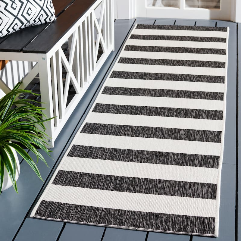 SAFAVIEH Courtyard Jetje Indoor/ Outdoor Waterproof Backyard Patio Rug - 2'3" x 8' Runner - Ivory/Black