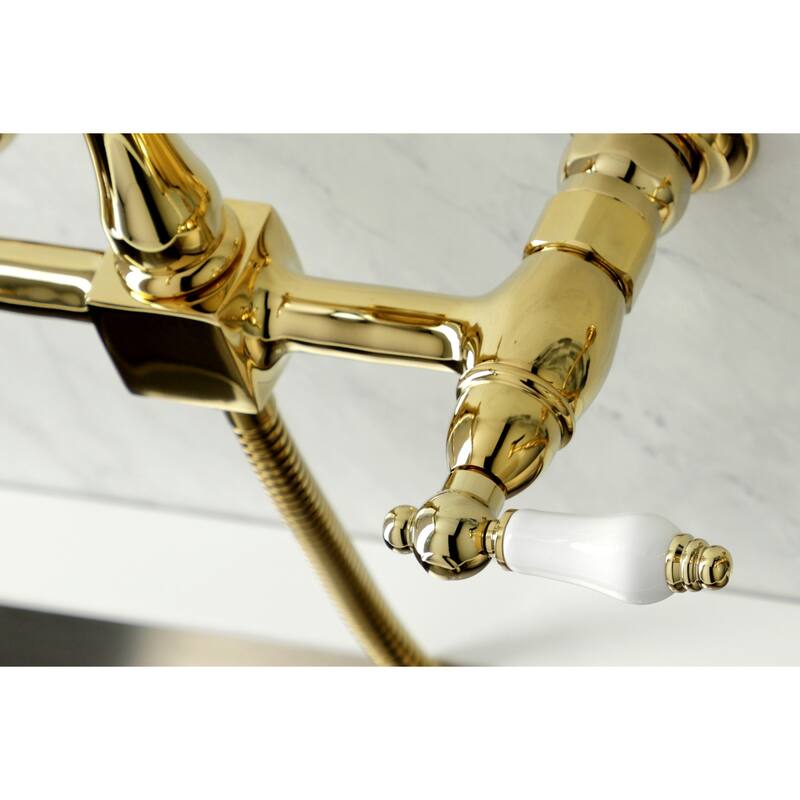 Kingston Brass Heritage Wall Mount Bridge Kitchen Faucet with Brass Sprayer