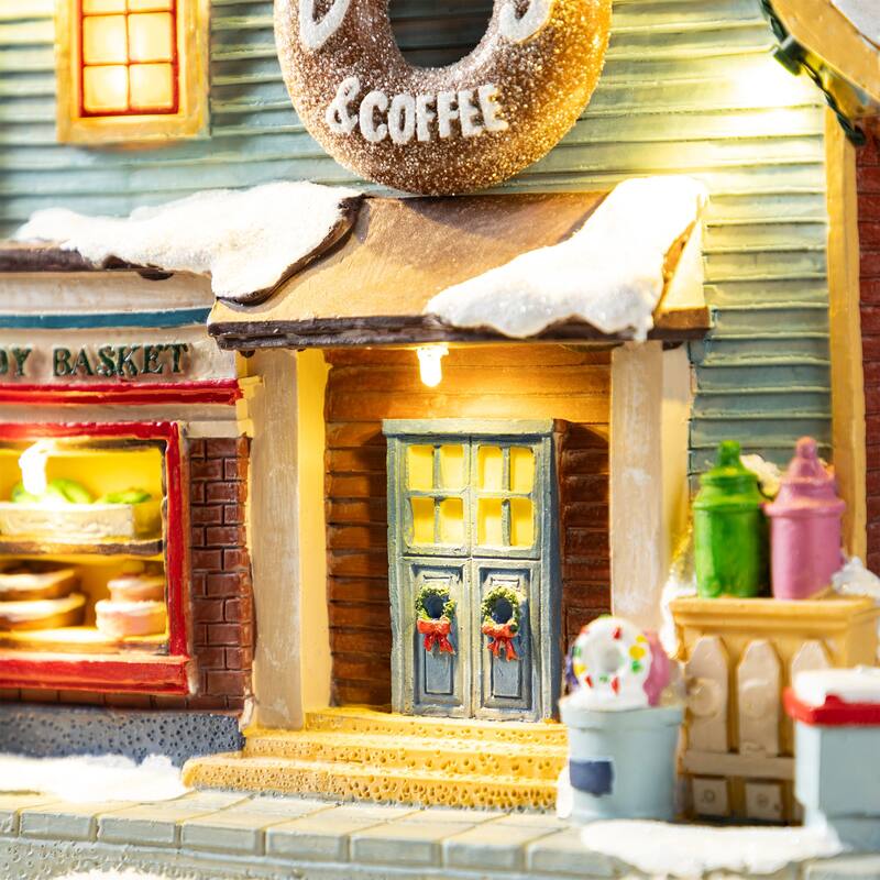 Glitzhome 10.25"H Lighted Christmas Donuts & Coffee Shop Resin Village with Movement and Music