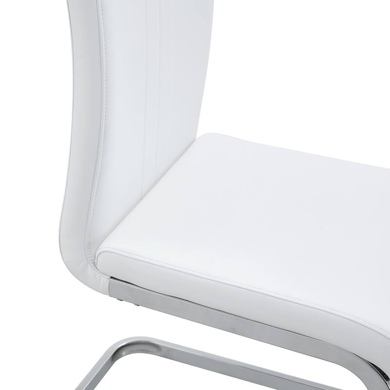 A set of 4 white PU material bow-shaped chairs - Adding fashion to minimalist and contemporary home styles
