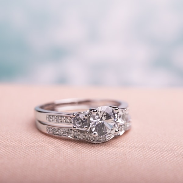 Miadora 10k White Gold Created White Sapphire and 1/6ct TDW Diamond 3-stone Bridal Ring Set (G-H, I2. Opens flyout.