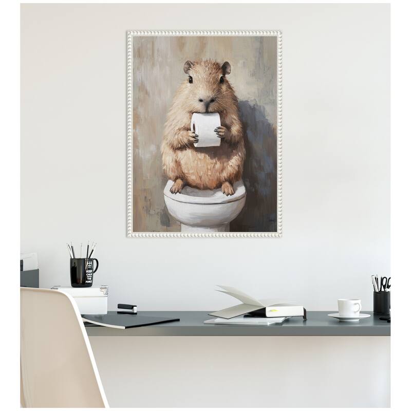 Kate and Laurel Sylvie Capybara Holding Toilet Paper Roll Toilet Bathroom Art Framed Canvas by The Creative Bunch Studio