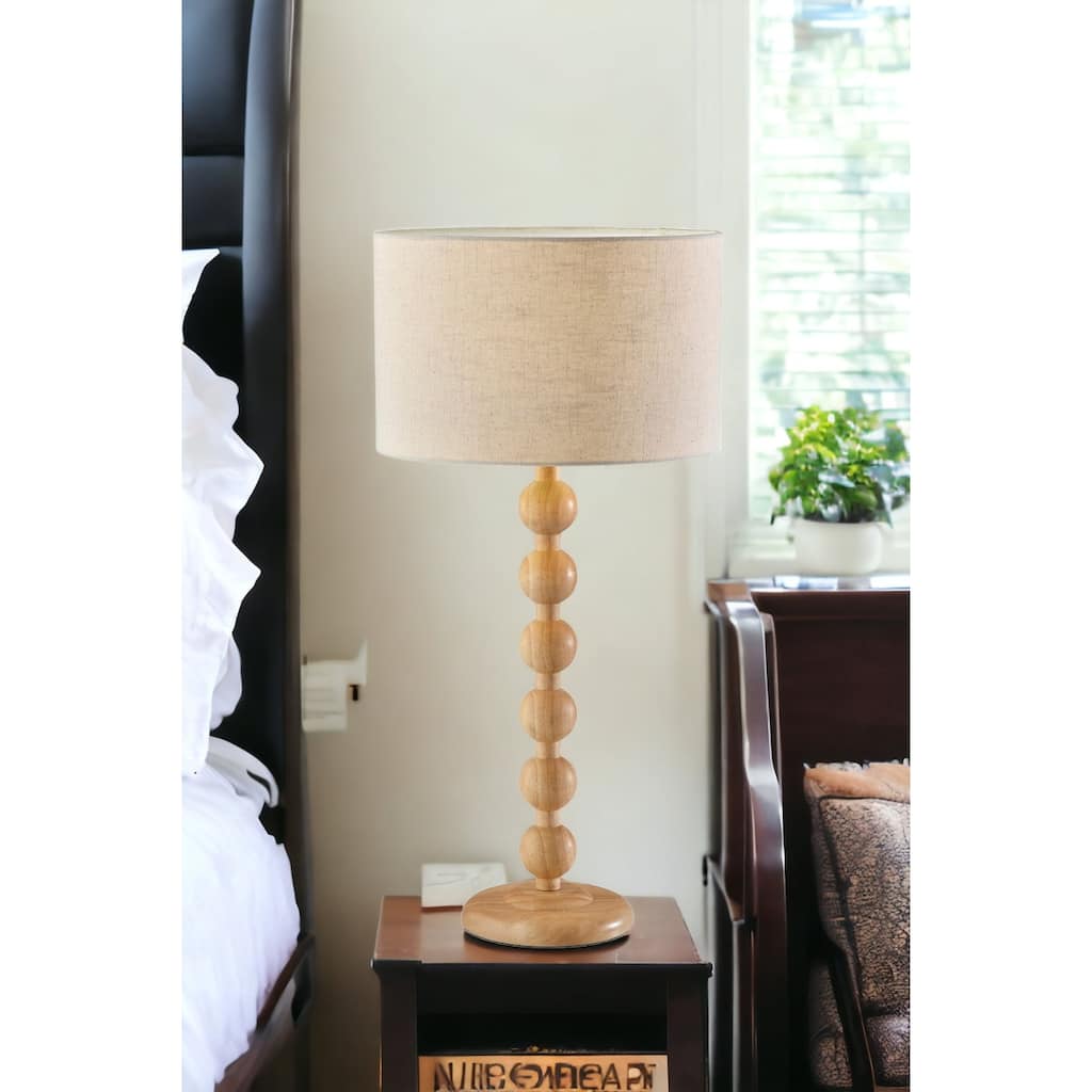 HomeRoots 28" Brown Solid Wood Candlestick Table Lamp With Off White Drum Shade - 13.75