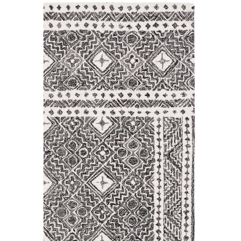 SAFAVIEH Handmade Micro-Loop Lutetia Wool Rug