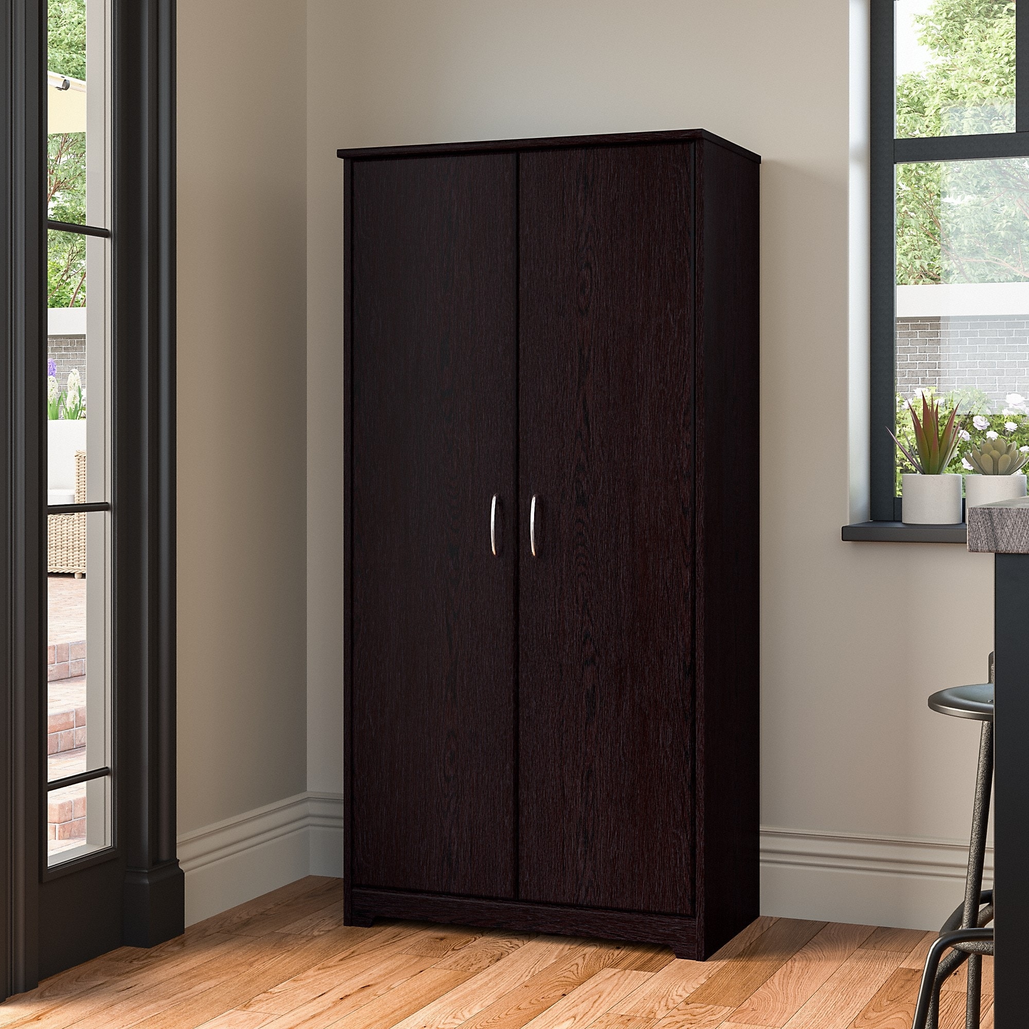 Very dark almost black wood two-door wardrobe with silver handles