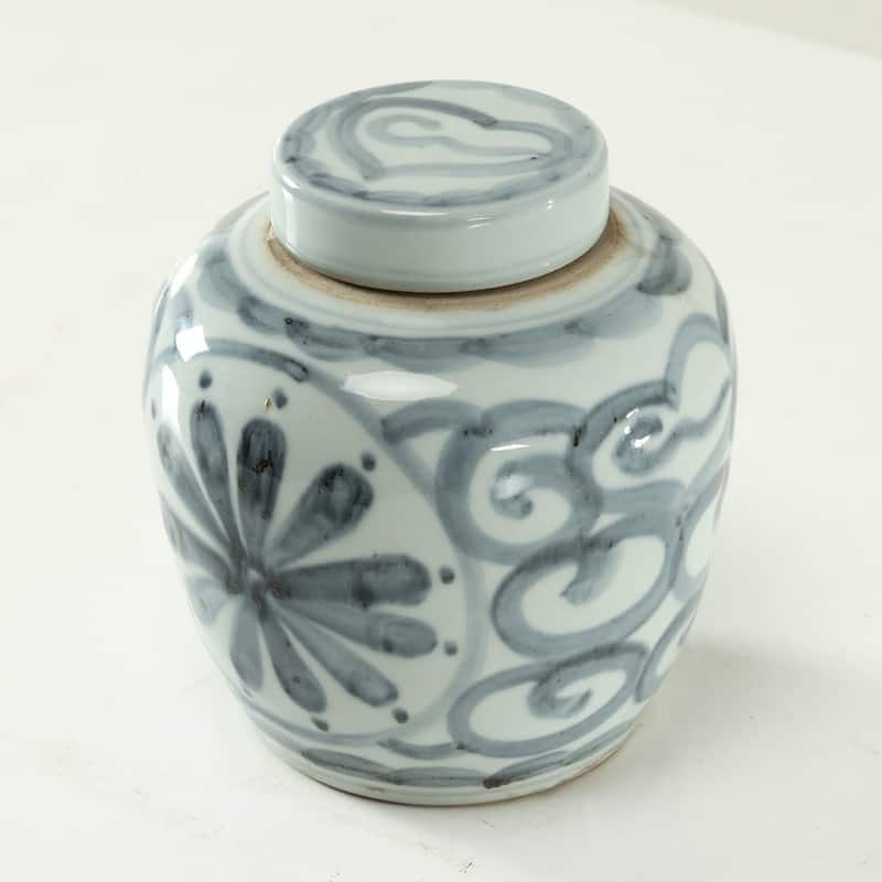 Approx.7 Inches Subtle Blue and White Round Jar with Floral Motif
