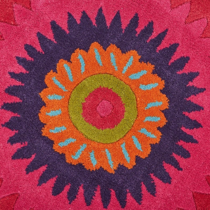 Sevita Bursting Peacock Wool Area Rug