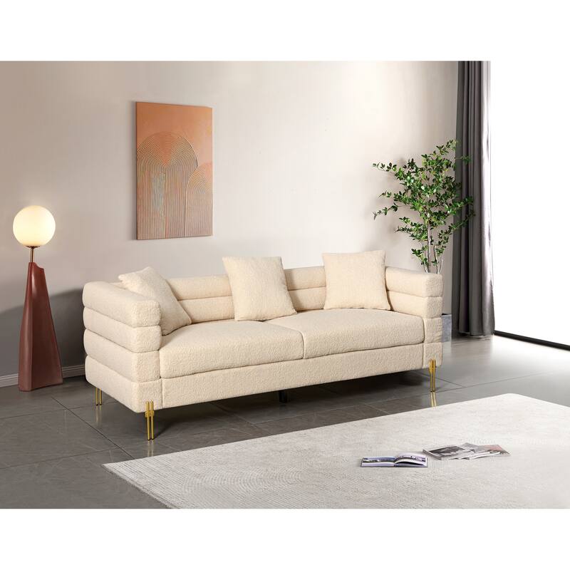 Luxurious and comfortable upholstered sofa with golden legs and pillows for living room and reception area - Beige