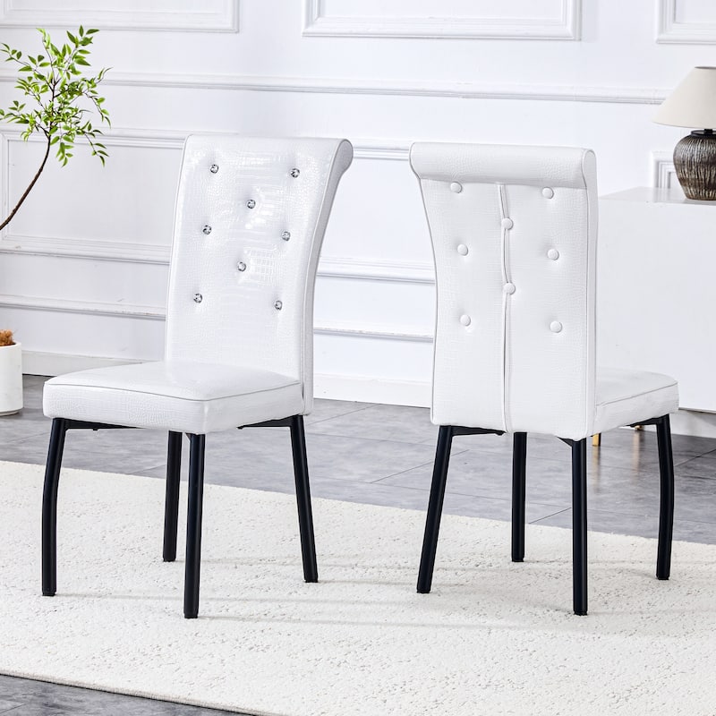 A set of 2 vintage crocodile leather cushioned dining chairs, featuring crystal clasp design and artificial leather design