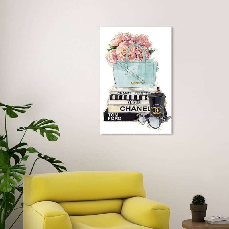 Wynwood Studio Fashion and Glam Blush Flowers Blue Purse and Books Light Pink Modern & Contemporary Wall Art Canvas Print - 30 x 20